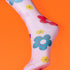 a close up of a foot with flowers on it
